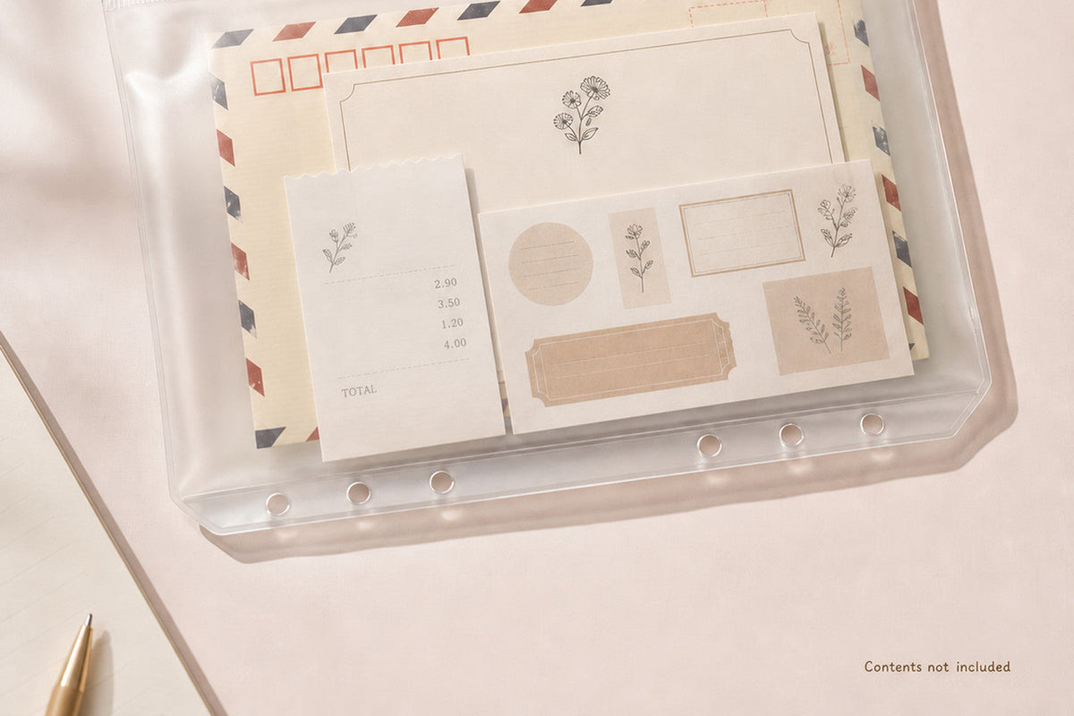 A5 clear zipper binder pocket holding receipts, notes, stickers, and planner supplies