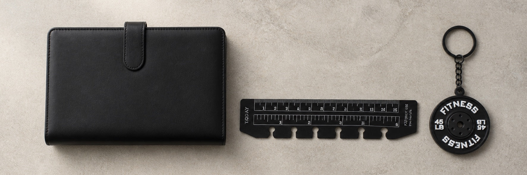 Black JoyJoy planner binder with black ruler bookmark and weight plate fitness charm