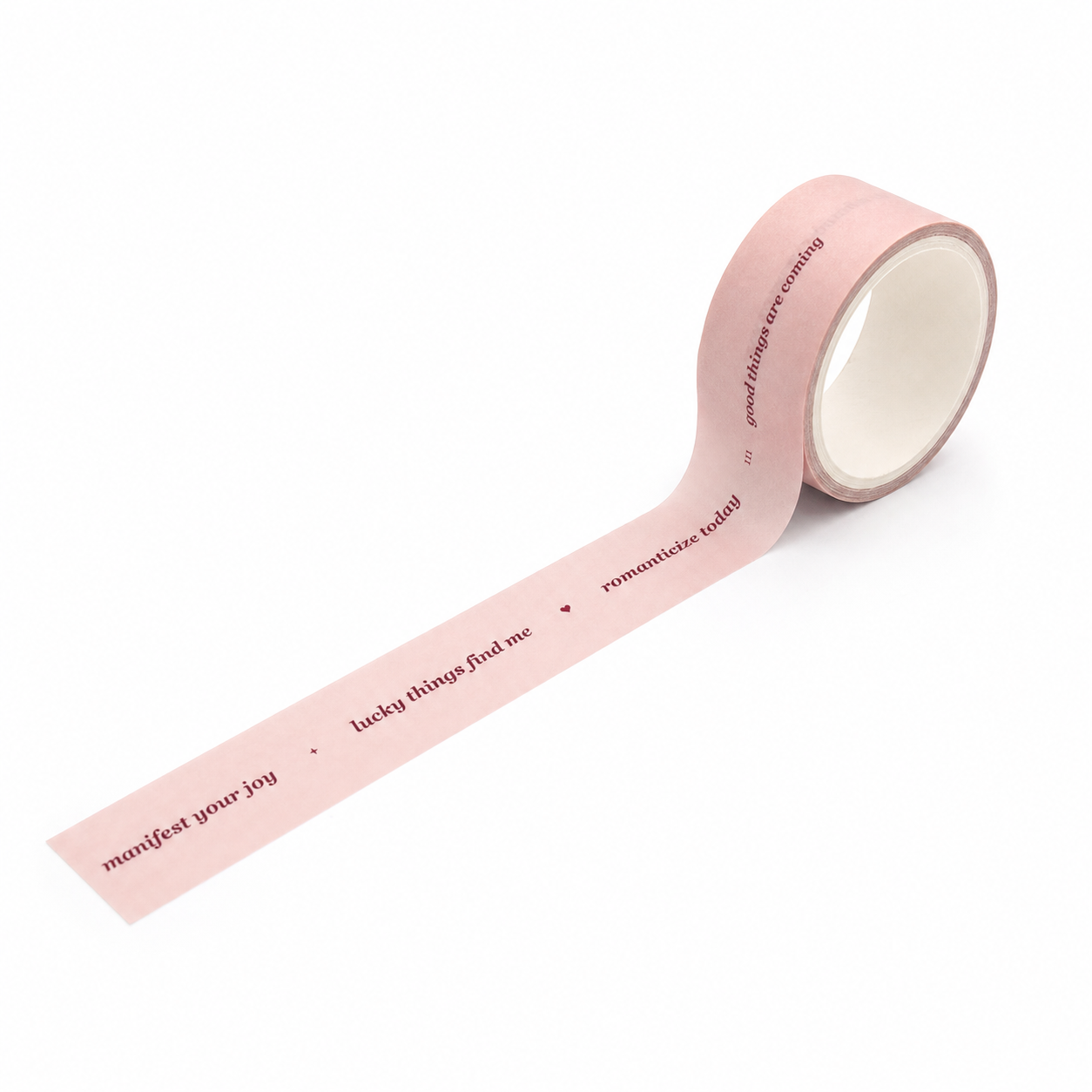 Manifest Your Joy pink affirmation washi tape unrolled on a white background