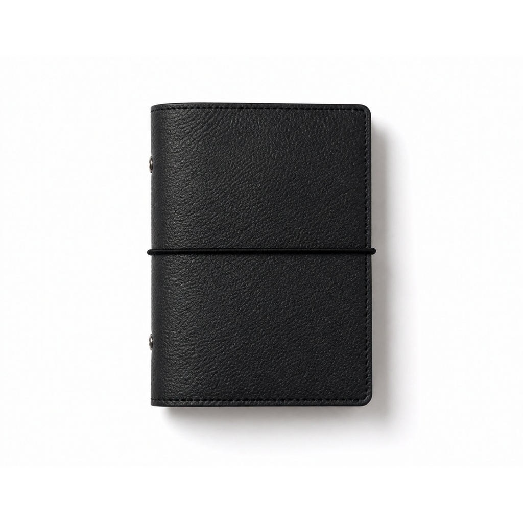 Black A7 Pocket six-ring planner cover with elastic closure on a white background