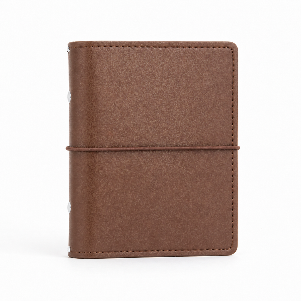 Dark Brown A7 Pocket six-ring planner cover with elastic closure on a white background