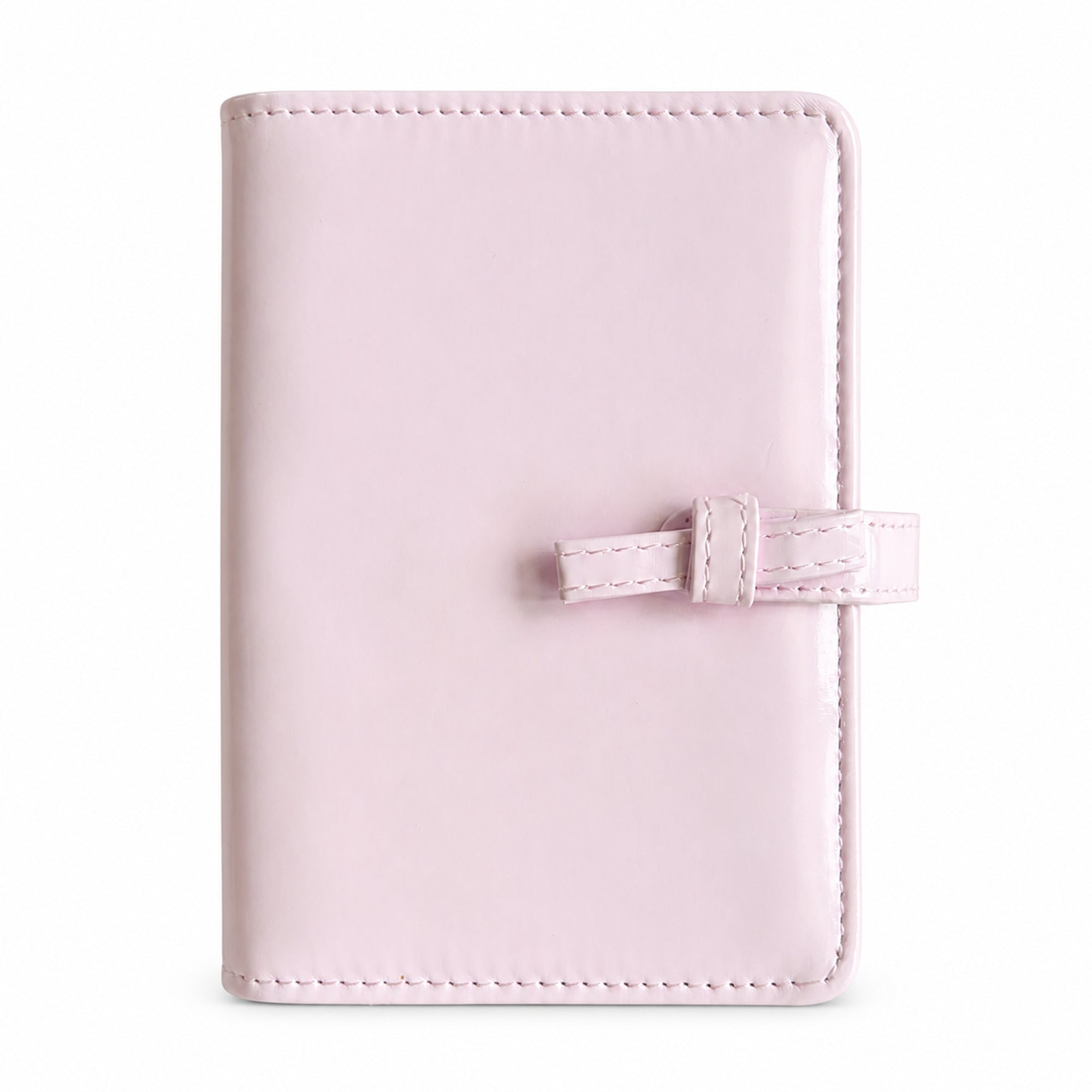 Blush pink bow A7 Pocket six-ring planner binder cover on a white background