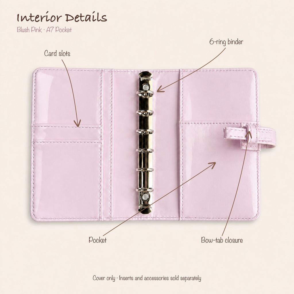 Opened blush pink bow A7 Pocket planner showing silver six-ring mechanism, two card slots and interior slip pockets