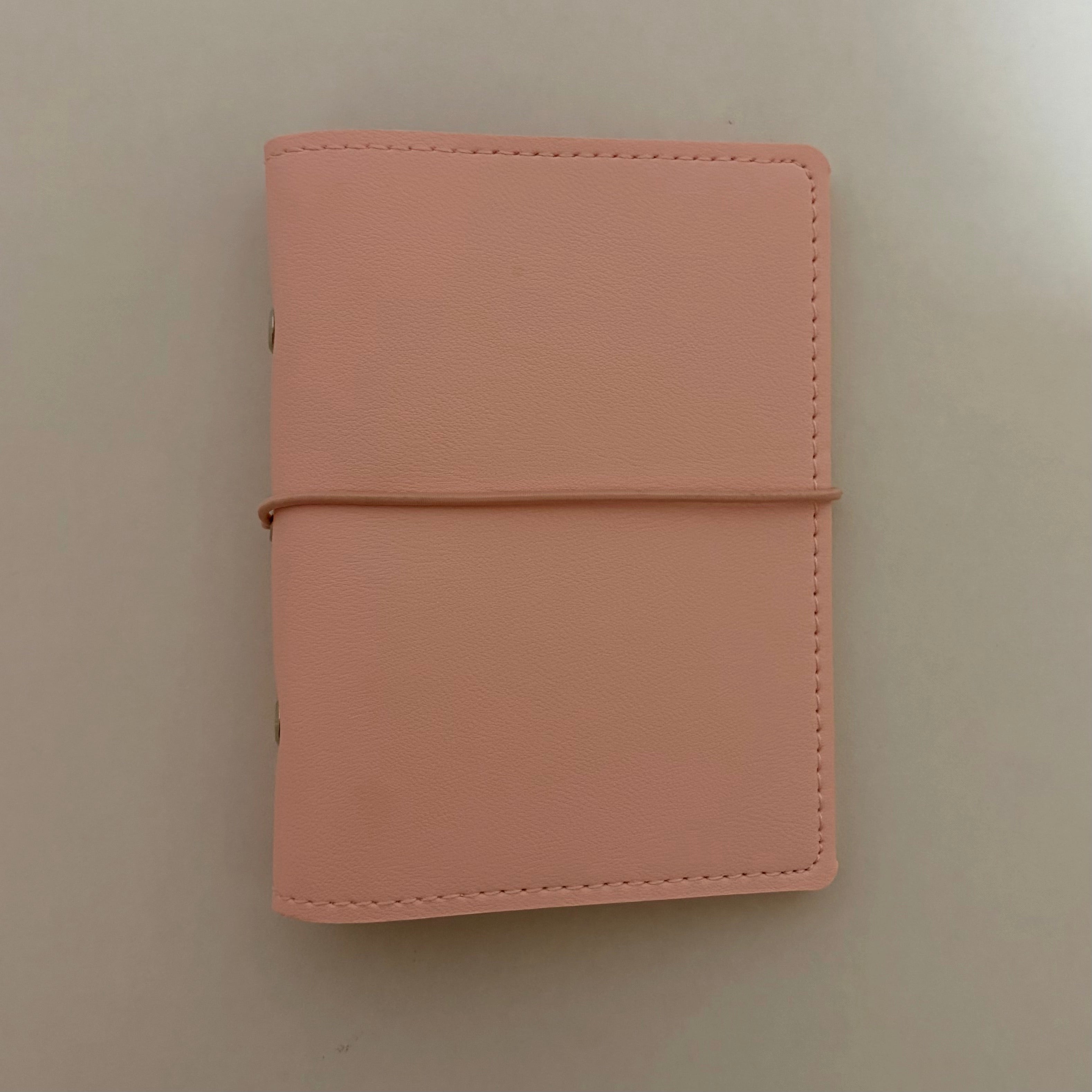 Close up details of premium soft pink vegan leather pocket journal