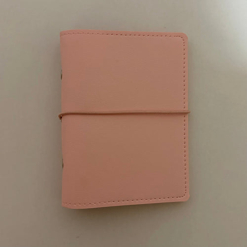Close up details of premium soft pink vegan leather pocket journal