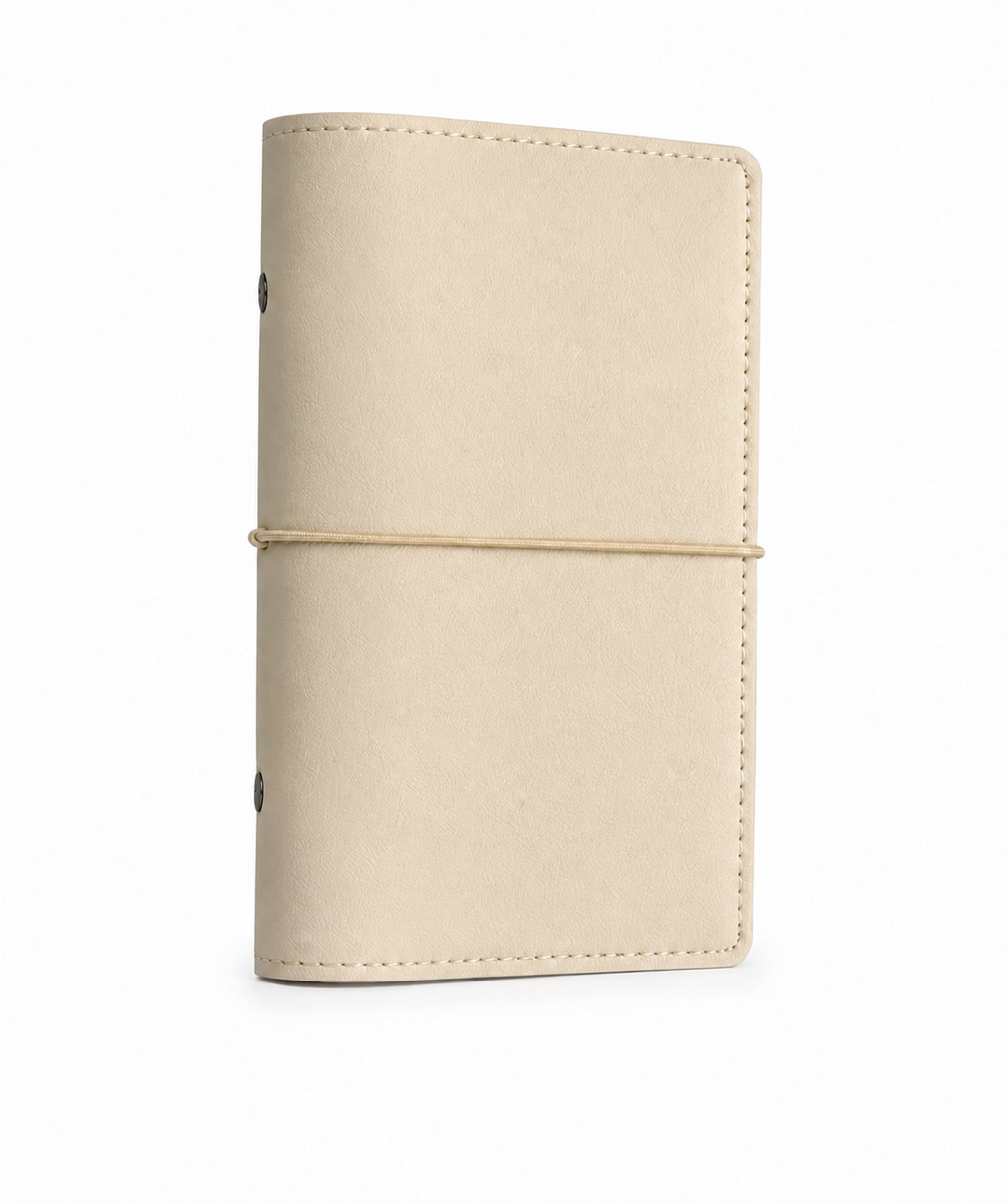 Beige A6 Personal six-ring planner cover with elastic closure on a white background