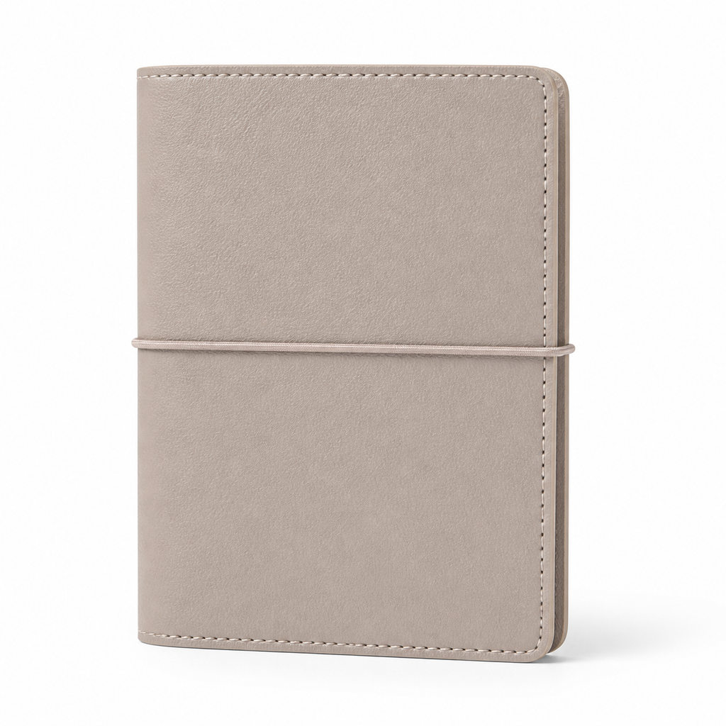 Beige A7 Pocket six-ring planner cover with elastic closure on a white background