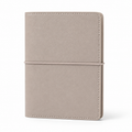 Beige A7 Pocket six-ring planner cover with elastic closure on a white background
