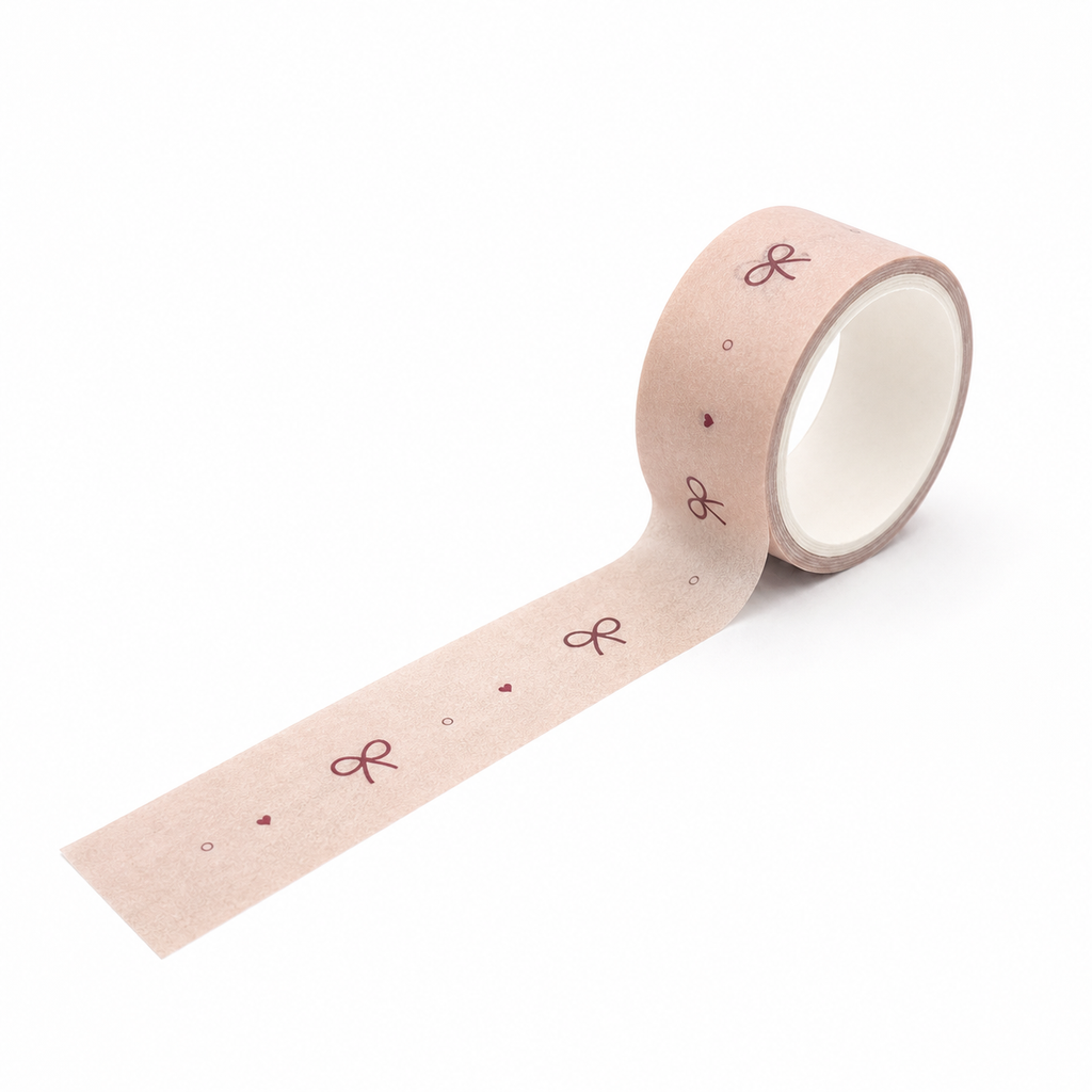 Blush pink bow decorative washi tape mini roll on a white background