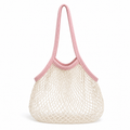 Blush pink and ivory cotton net tote bag on a white background
