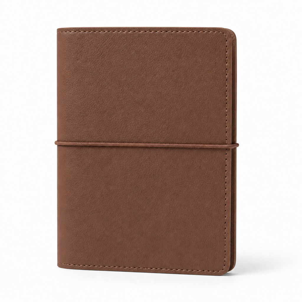 Brown A7 Pocket six-ring planner cover with elastic closure on a white background