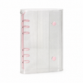 Clear glitter A6 double-snap binder cover with pink rings on a white background