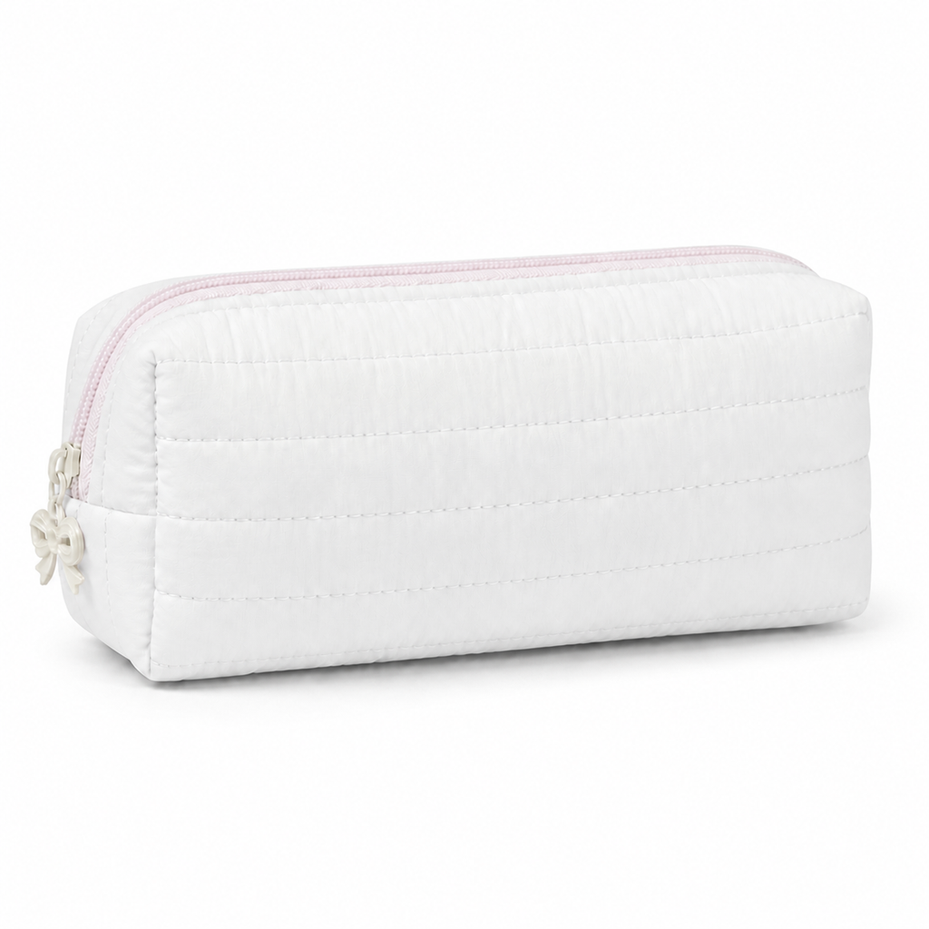 Off-white Cloud Puff quilted pencil case with soft pink zipper and ivory bow charm on a white background