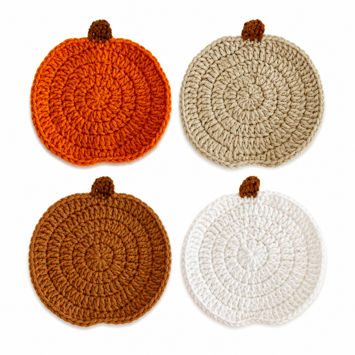 Set of four crochet pumpkin coasters in orange, oatmeal, caramel and white