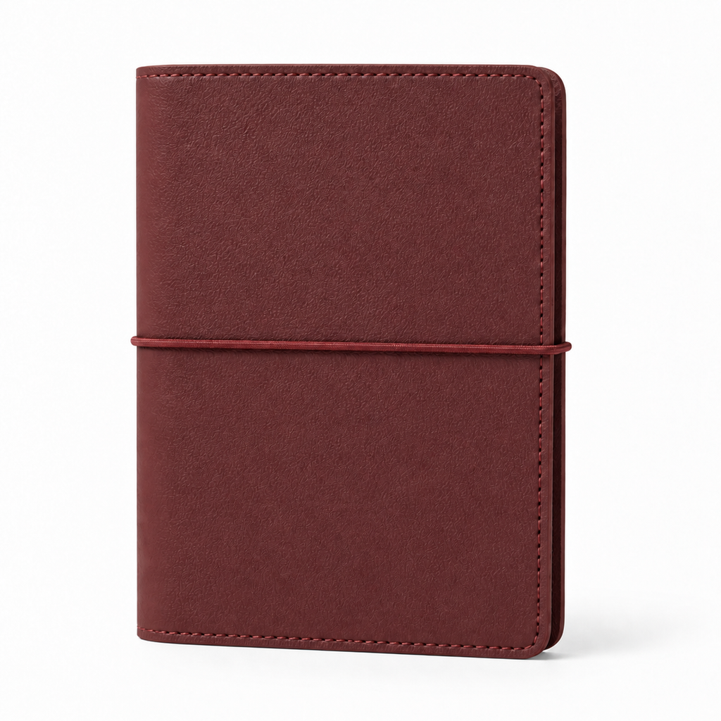 Dark Red A7 Pocket six-ring planner cover with elastic closure on a white background