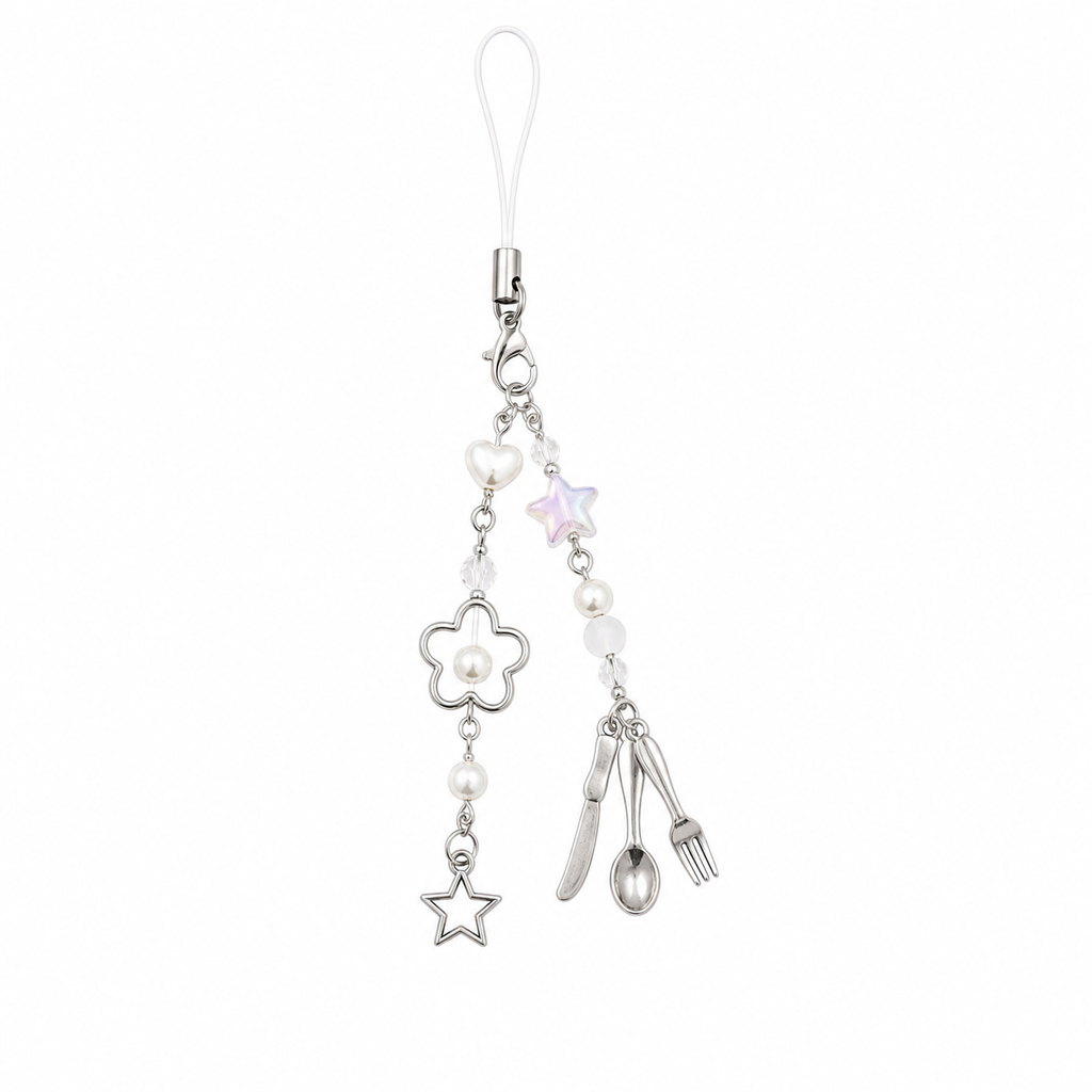 Fork spoon and knife phone charm with pearl beads and silver flower on a white background