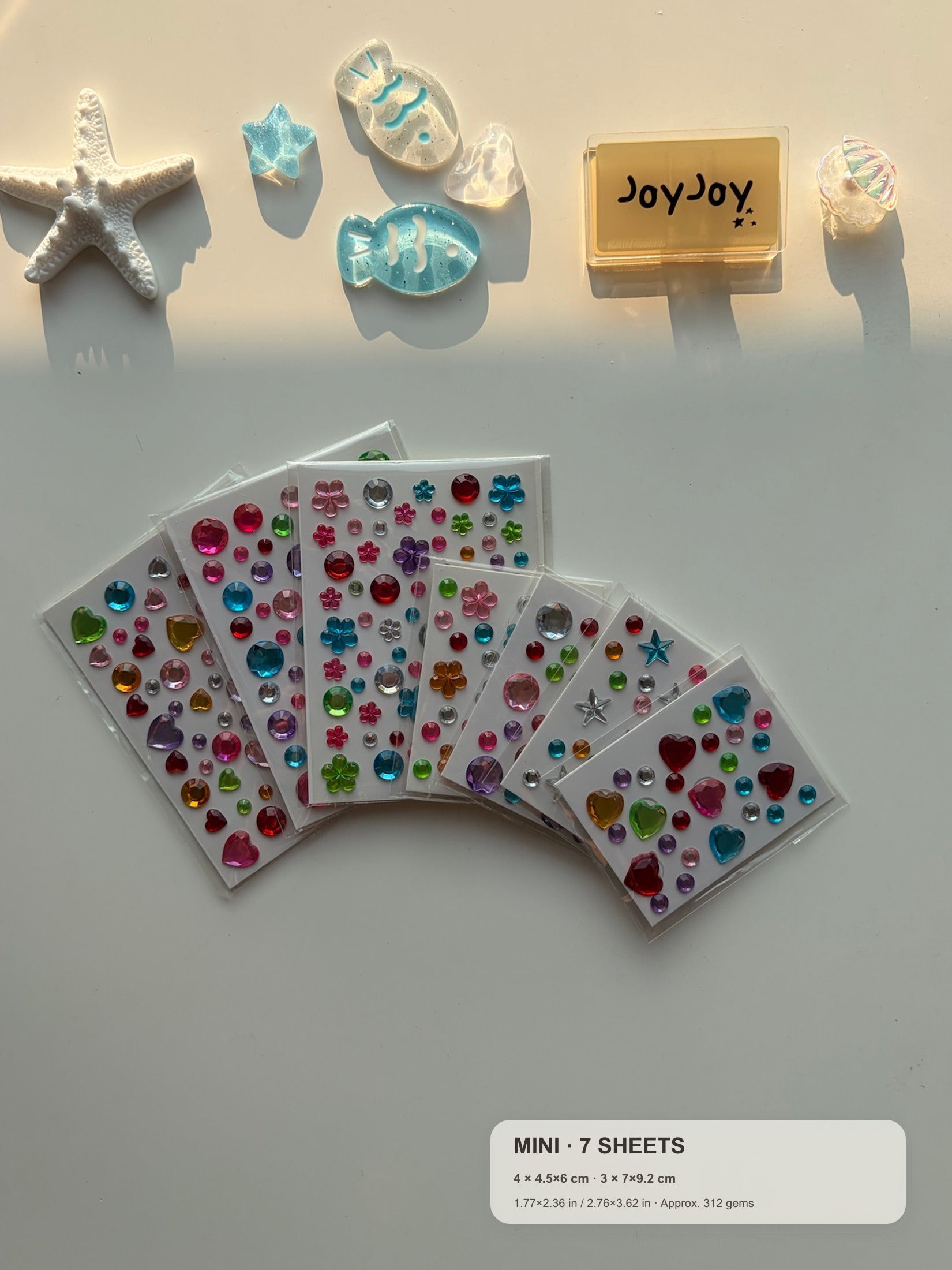 Centered-crop Mini Variety gem sticker pack fanned out with compact size guide: 7 sheets and approximately 312 gems