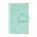 Green marble A6 budget binder cover with gold corner protectors on a white background