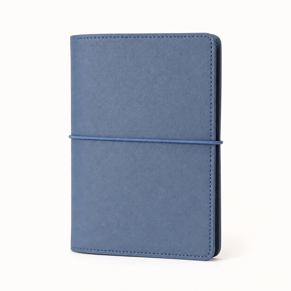 Light Blue A7 Pocket six-ring planner cover with elastic closure on a white background