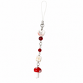 Red mushroom beaded phone and planner charm on a white background