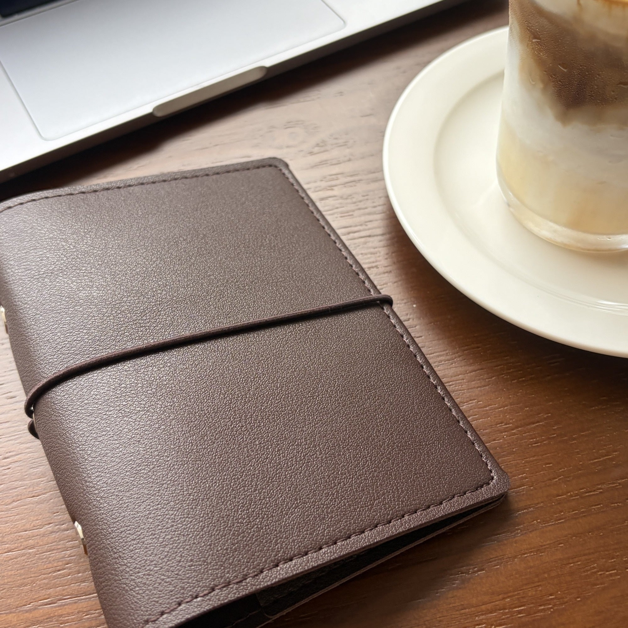 Close detail of cocoa brown A7 pocket planner cover with elastic closure