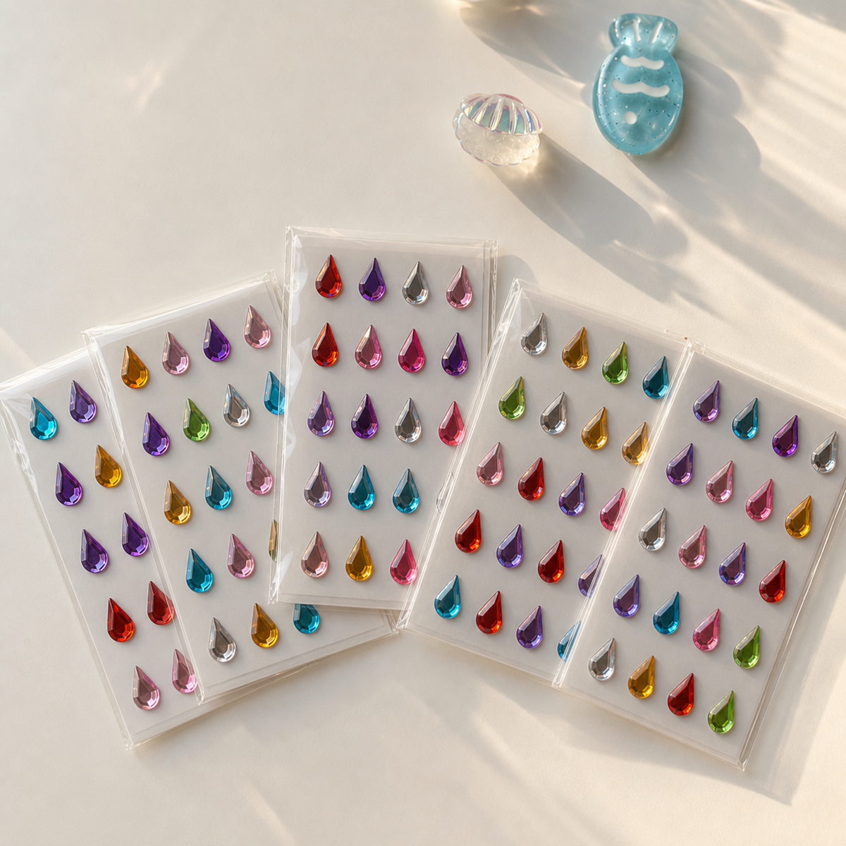 Five colorful self-adhesive teardrop mix — 24 gems sticker sheets; each sheet may have different colors and gem arrangements