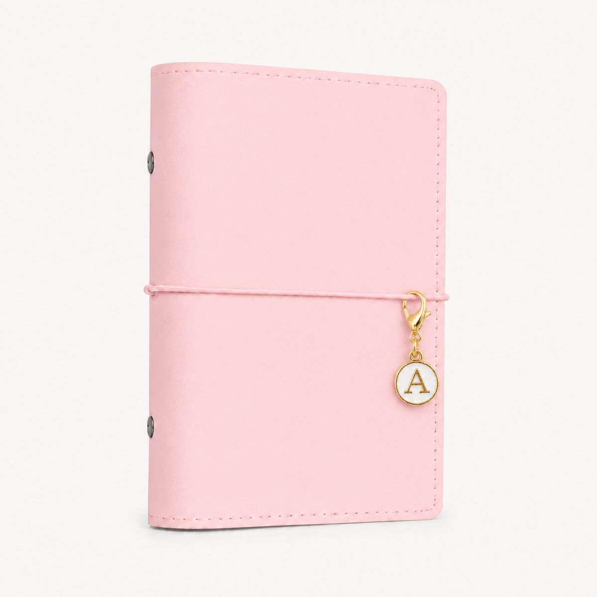 White and gold initial planner charm clipped to a baby pink Soft Series A6 ring planner