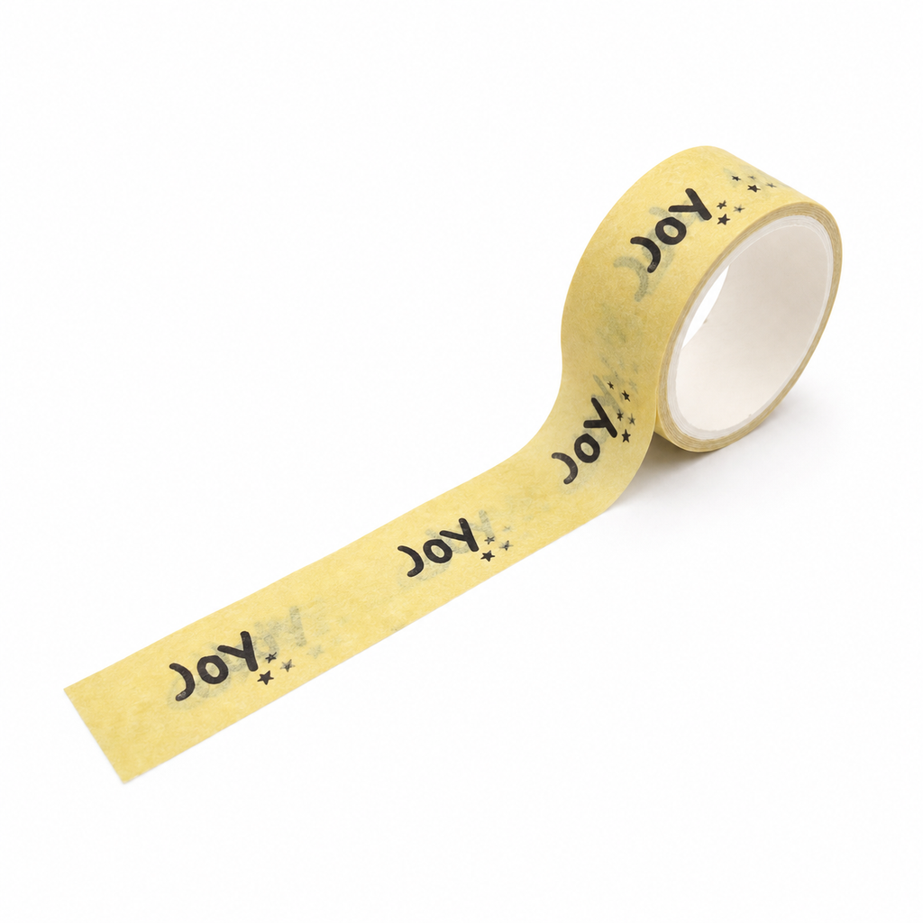 Yellow JOY decorative washi tape mini roll on a white background